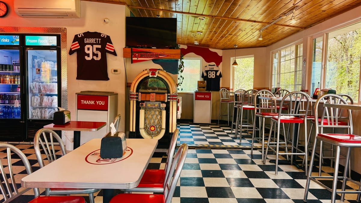 Checkered floors, jukebox, red stools
